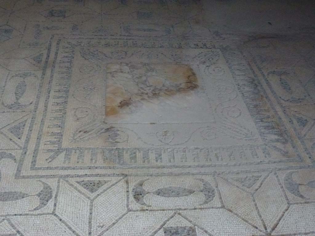 V.30 Herculaneum, October 2012. 
Oecus 1, flooring of black and white mosaic, and emblema in centre made of yellow “marmo antico”. Photo courtesy of Michael Binns.